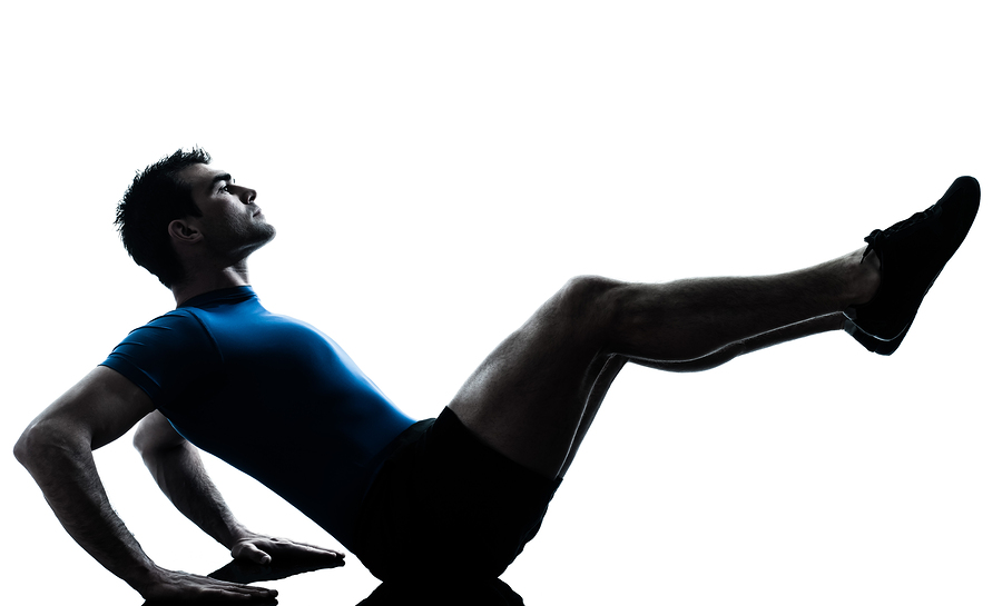 one caucasian man exercising workout fitness in silhouette studi